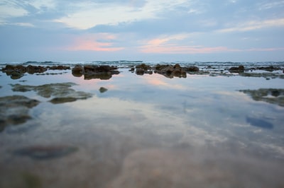 The waters of the cloudy sky during the day
